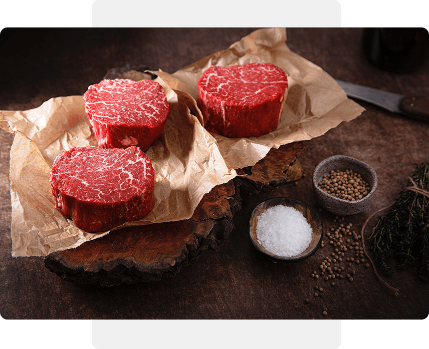 A table with some raw meat on it